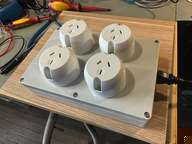three electrical outlets on a table with wires