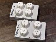 two white switches on a wooden floor